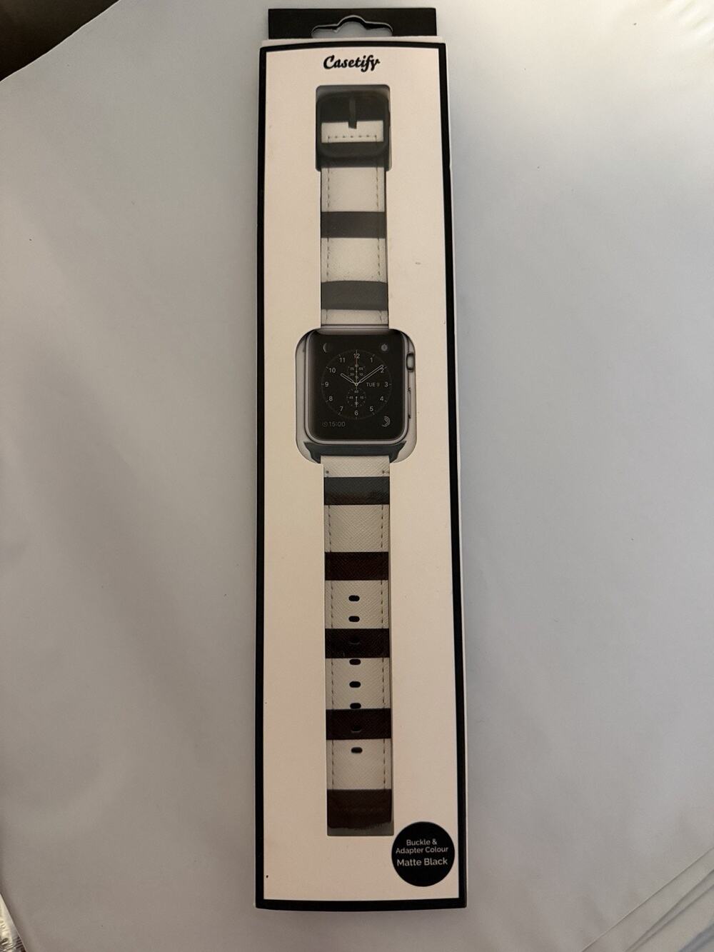 Casetify Apple Watch band featuring a black and white striped design